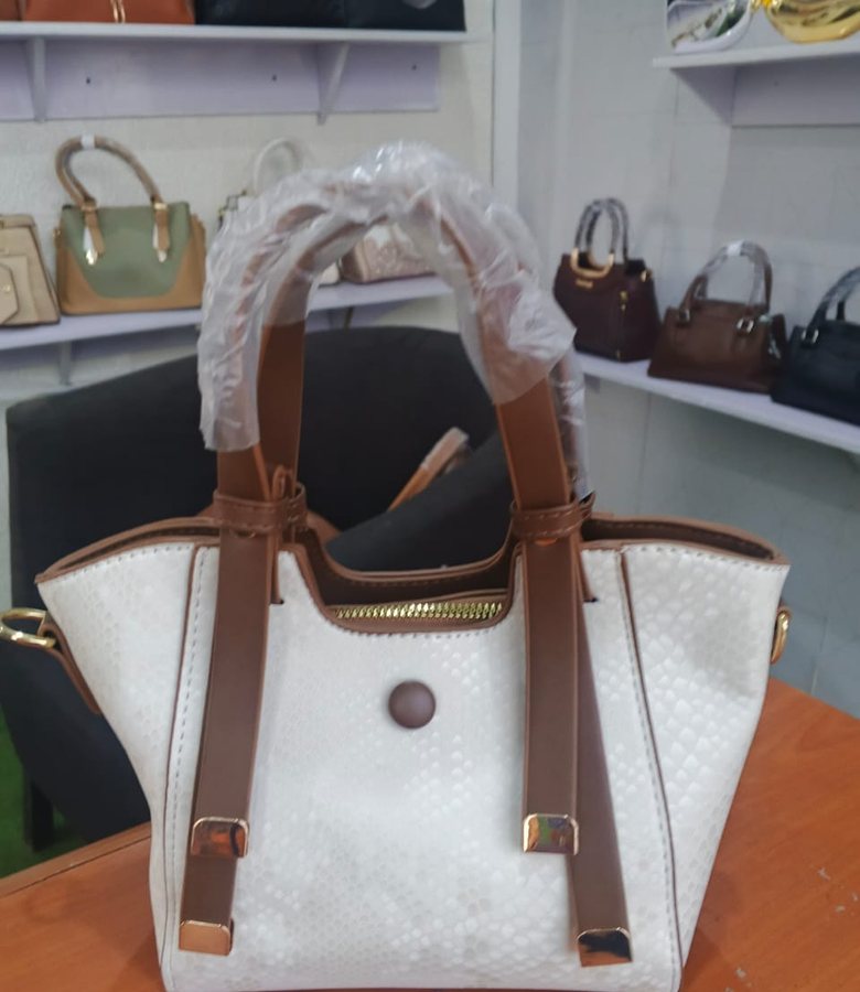 Ivory trapeze tote with brown straps